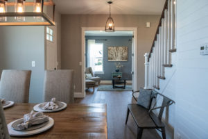 Interior of the modern farmhouse showing front entry dining room and family room