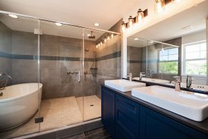 Bathroom With Dual Sinks and Separate Bath With Shower