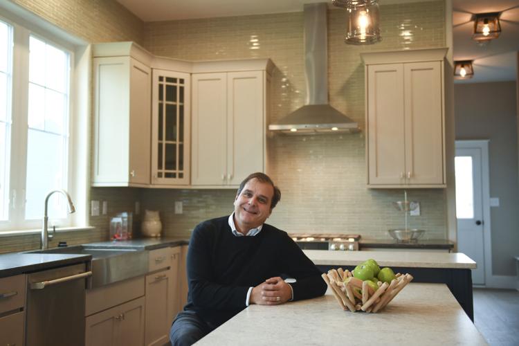 Peter Rotelle Sitting in a Newly Built Kitchen