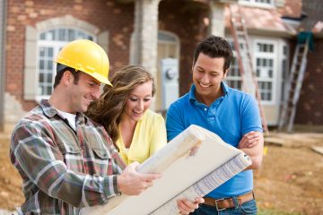 People Looking at a Home Design Plan with Construction Worker