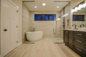 Full bathroom with separate tub in the large shower area