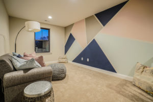 Room with couch and wall painted multiple colors