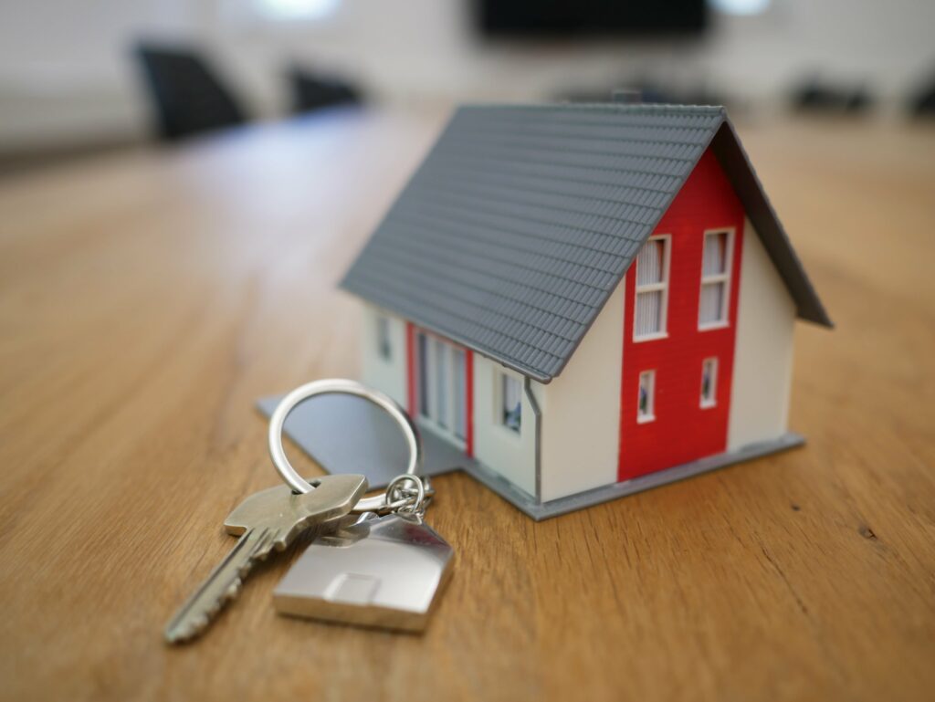 small house with a set of keys next to it